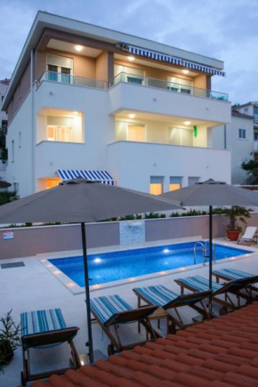 Seaside apartments with a swimming pool Rastici, Ciovo - 11092